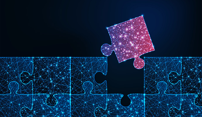 a puzzle with one piece missing on a dark blue background. The connected puzzle pieces are blue, and a pink piece is being placed in the open space