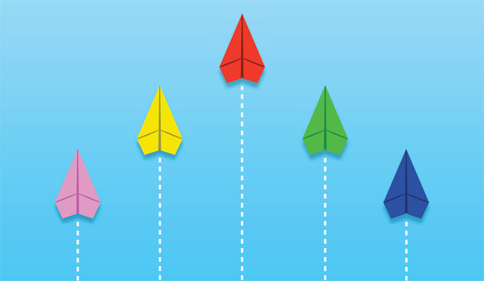 Paper airplanes flying in a triangular formation on a light blue background. From left to right, they are pink, yellow, red, green, and blue.
